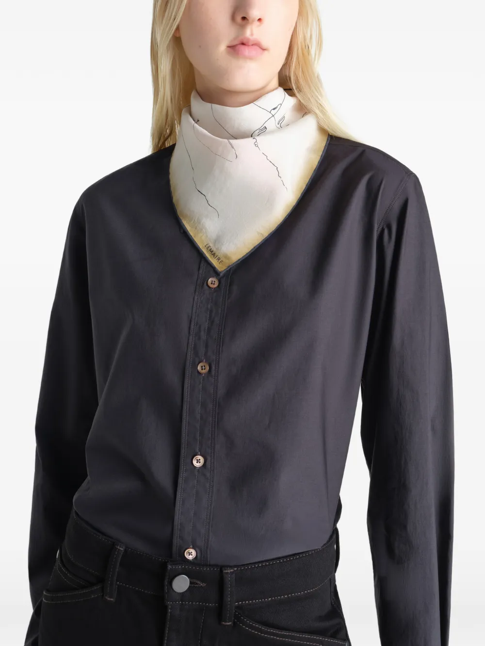 Tan scarves worn by a person, showing the scarves fit