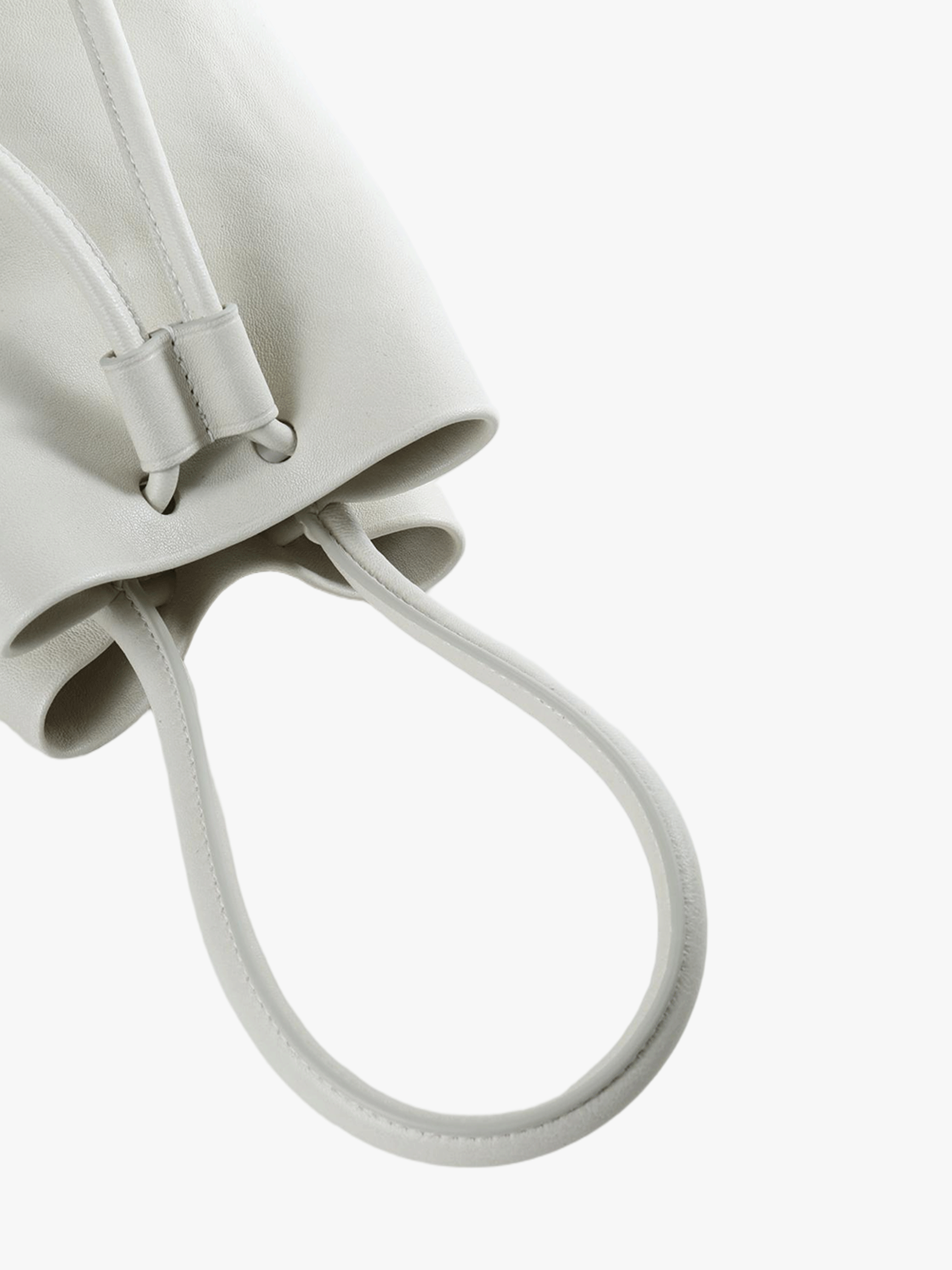 Close up of white bag, showing texture of the calf leather fabric