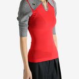 Red knitwear worn by a person, showing the knitwear's fit