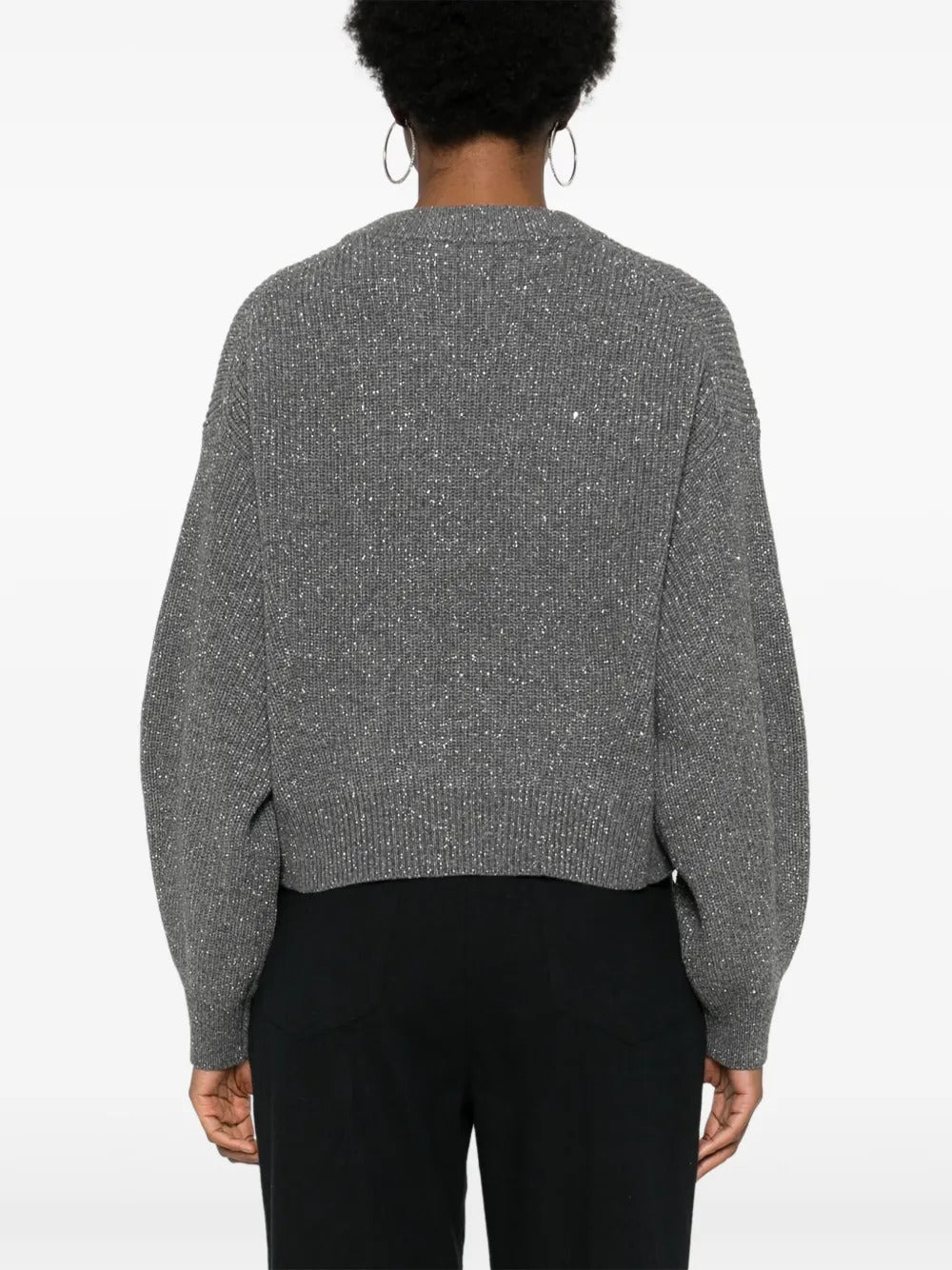 Grey knitwear worn by a person, showing the knitwear's fit