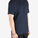 Navy t-shirt worn by a person, showing the t-shirt's fit