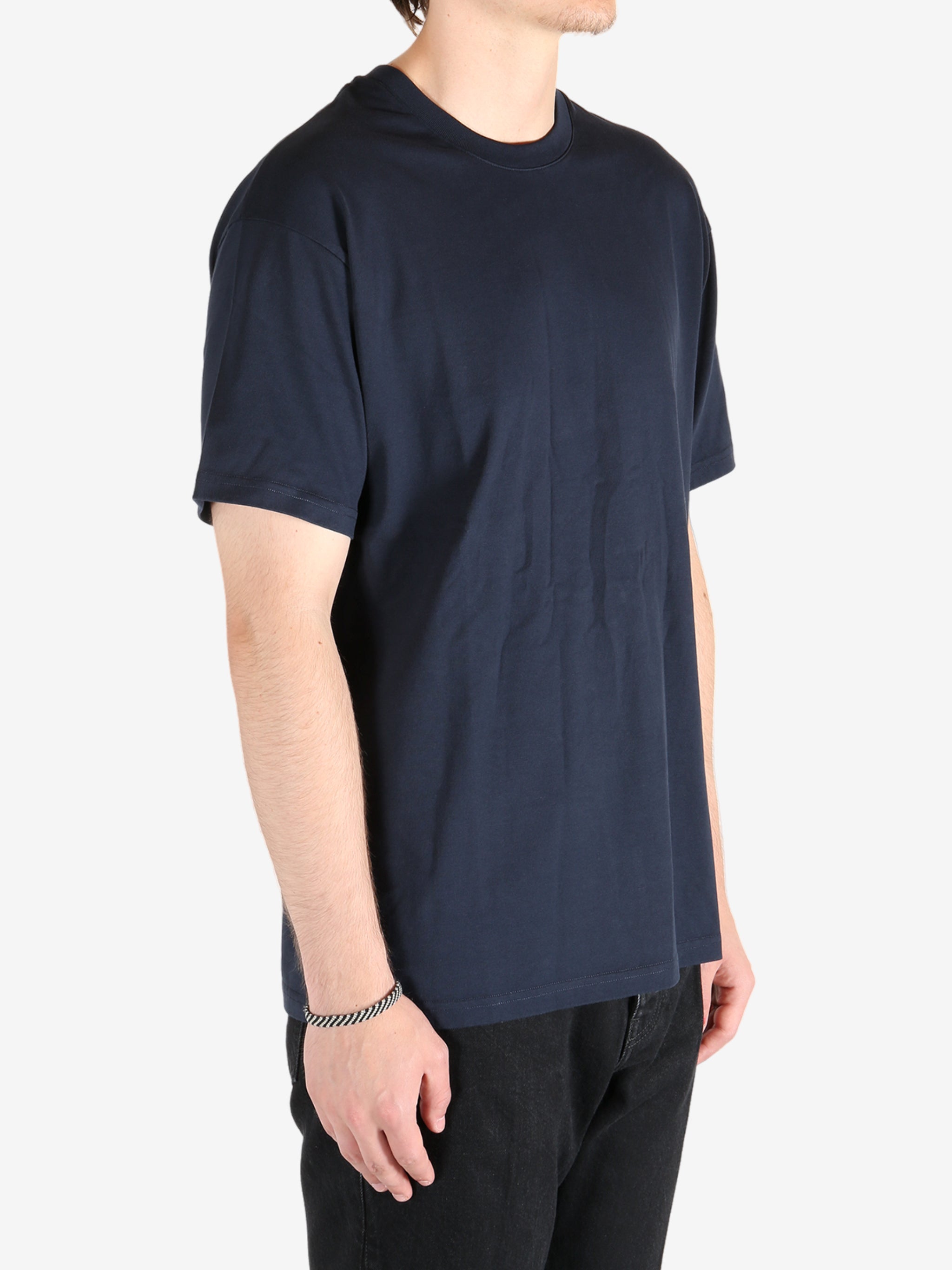 Navy t-shirt worn by a person, showing the t-shirt's fit