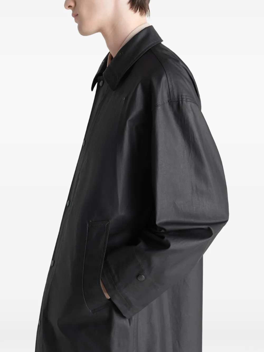 Close up of black jacket, showing the detail of the cotton material