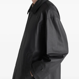 Close up of black jacket, showing the detail of the cotton material