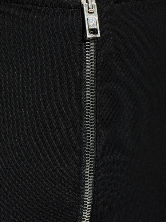 Close-up of black pants, showing texture of the viscose fabric