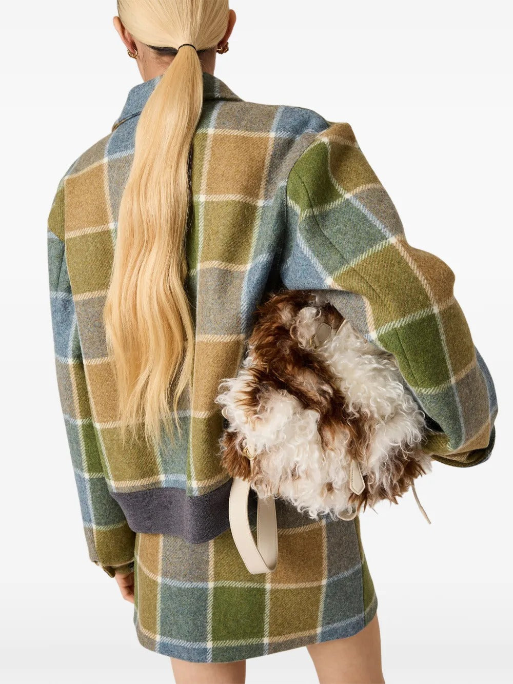 Tan jackets worn by a person, showing the jackets fit