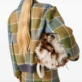 Tan jackets worn by a person, showing the jackets fit