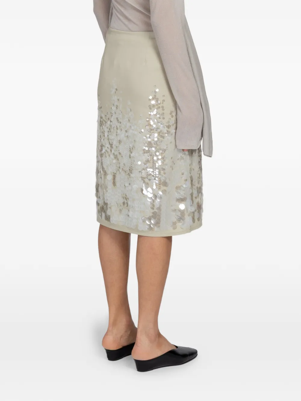 Tan skirts worn by a person, showing the skirts fit