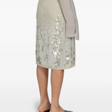 Tan skirts worn by a person, showing the skirts fit