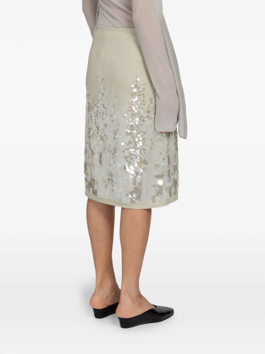 Tan skirts worn by a person, showing the skirts fit