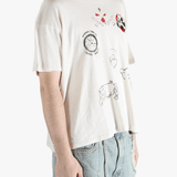 White t-shirt worn by a person, showing the shirt's fit