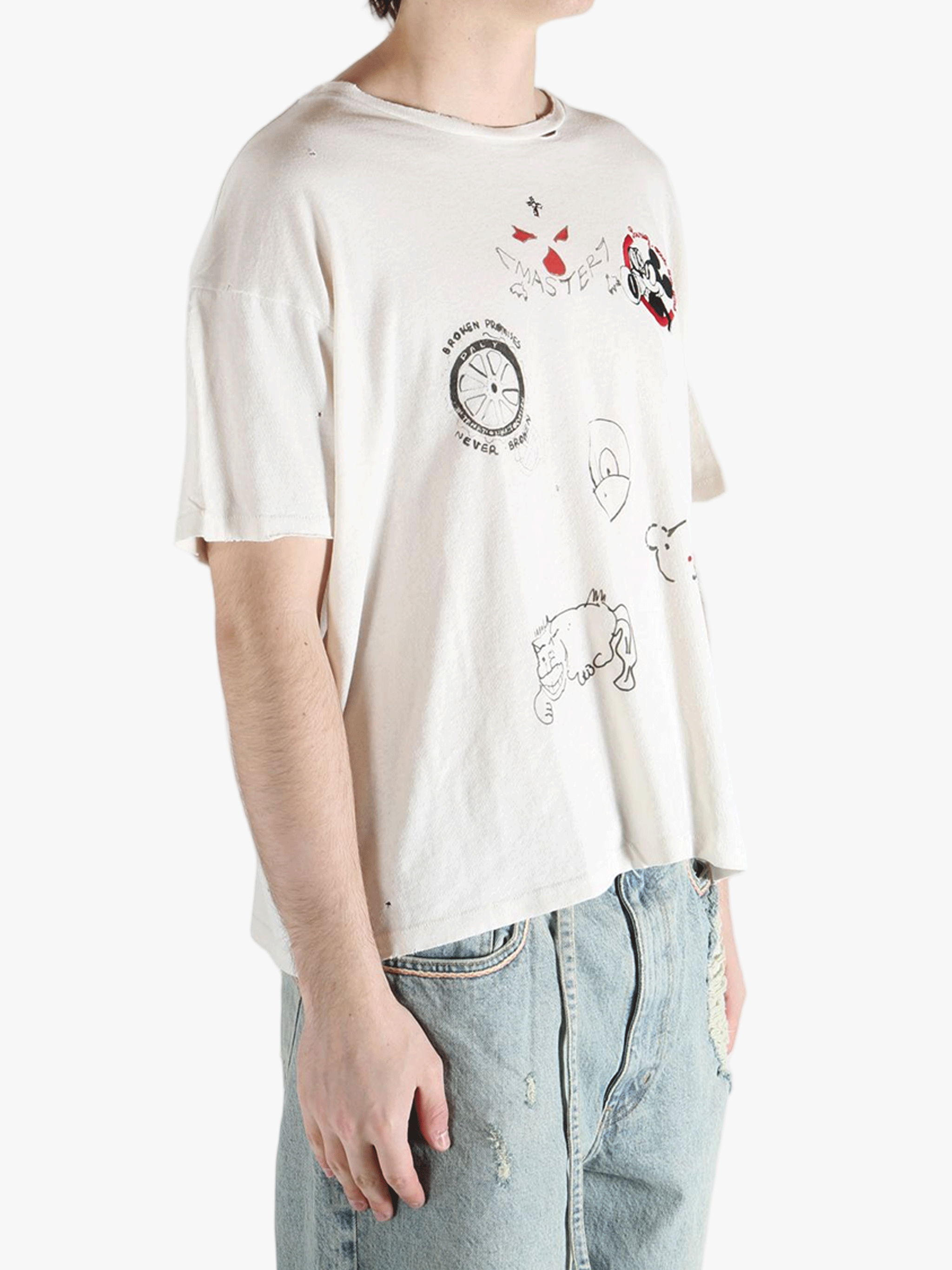 White t-shirt worn by a person, showing the shirt's fit