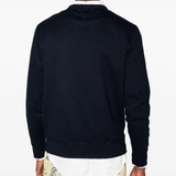 Navy knitwear worn by a person, showing the knitwear fit