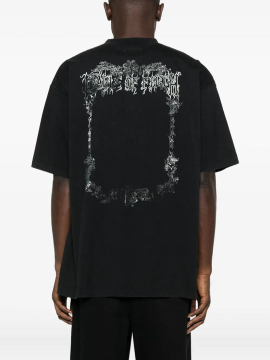 Black t-shirt worn by a person, showing the shirt's fit