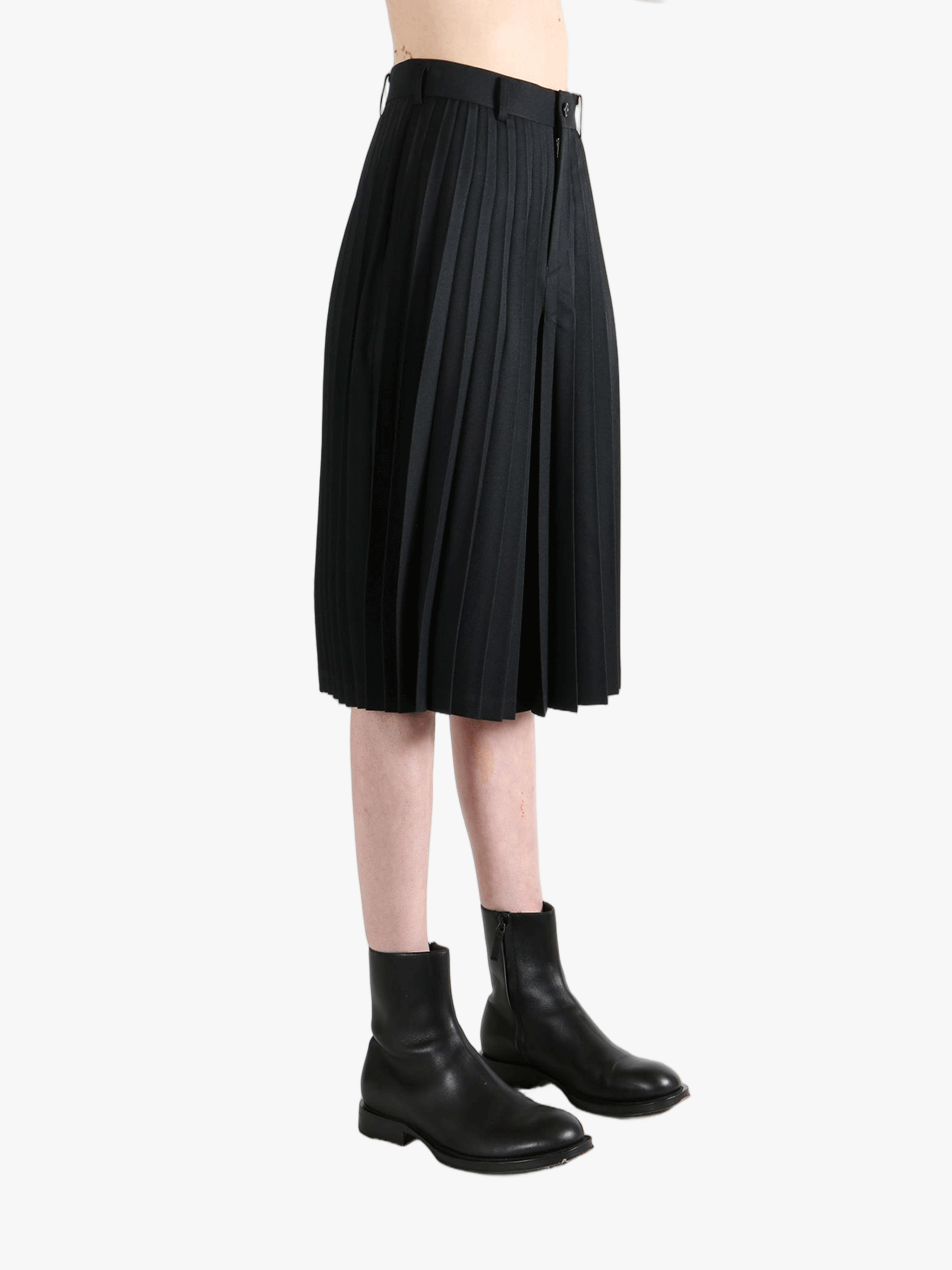 black pants worn by a person, showing the pants  fit