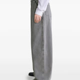 Grey pants worn by a person, showing the pants' fit