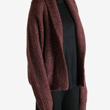 Red cardigan worn by a person, showing the cardigan's fit