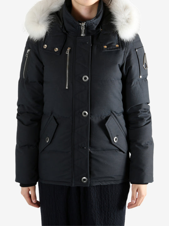 Black jackets worn by a person, showing the jackets fit