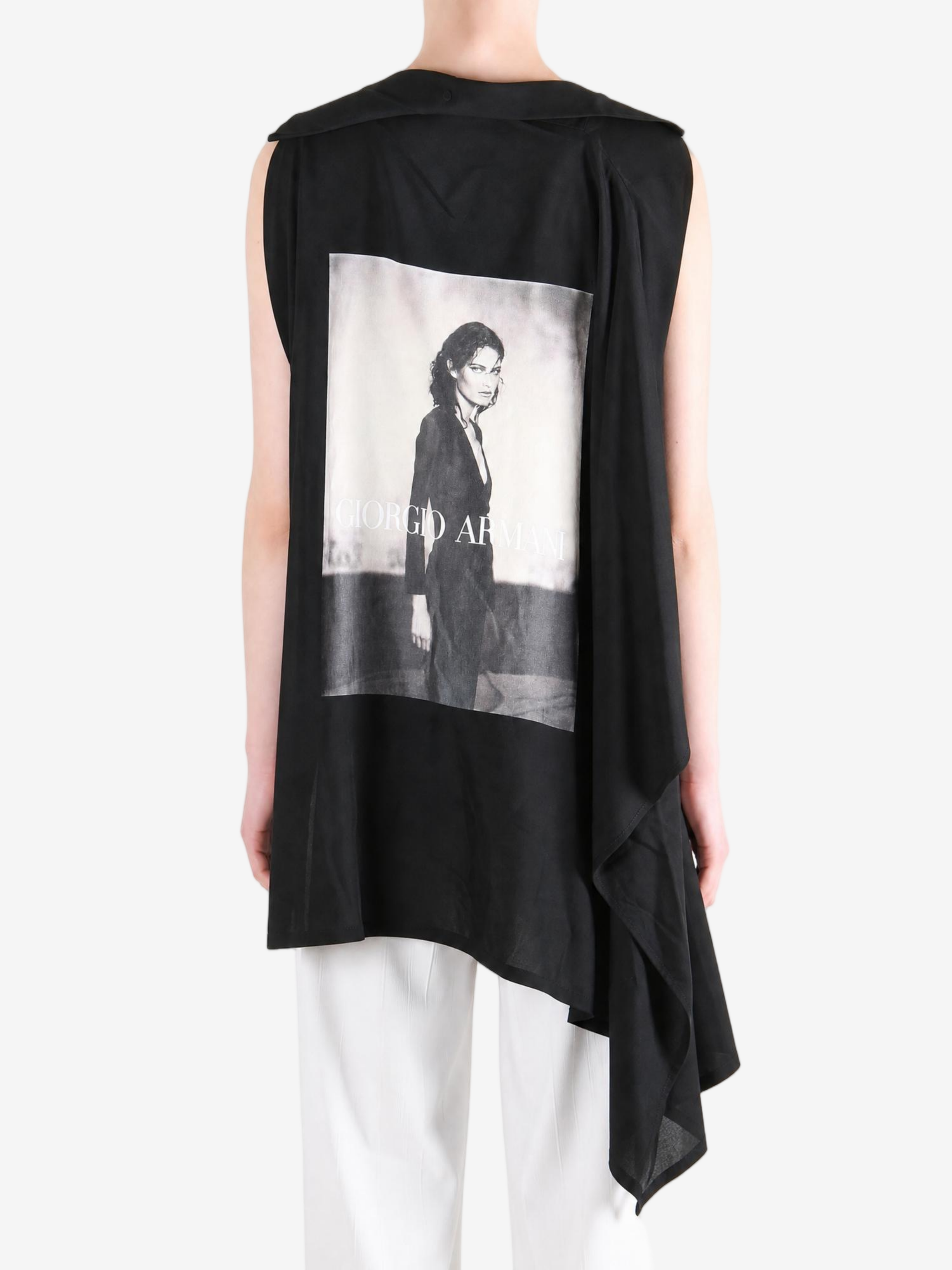 Black dress worn by a person, showing the dress fit