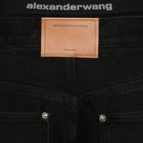 Close up of black jeans, showing texture of the Cotton fabric