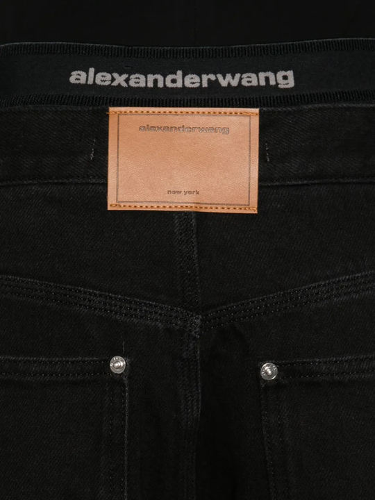 Close up of black jeans, showing texture of the Cotton fabric