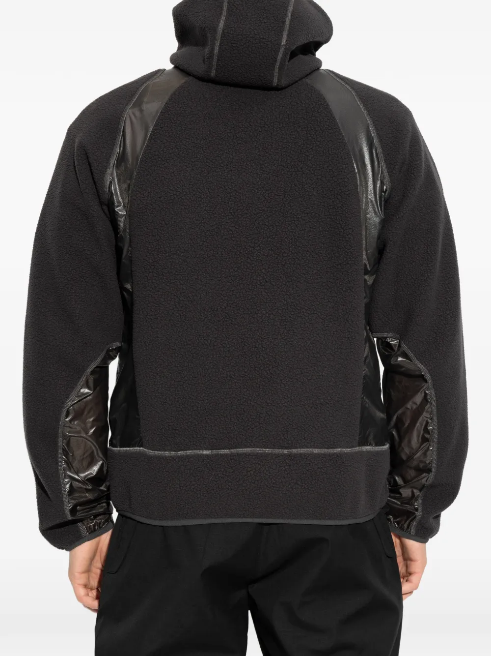 Black hoodie worn by a person, showing the hoodie fit