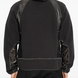 Black hoodie worn by a person, showing the hoodie fit