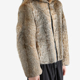 Tan jacket worn by a person, showing the jacket fit