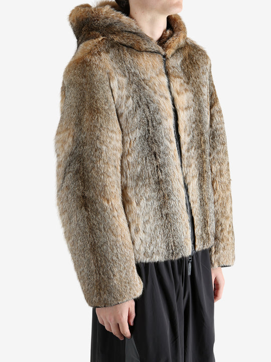 Tan jacket worn by a person, showing the jacket fit