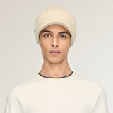 Tan hat worn by a person, showing the hat fit