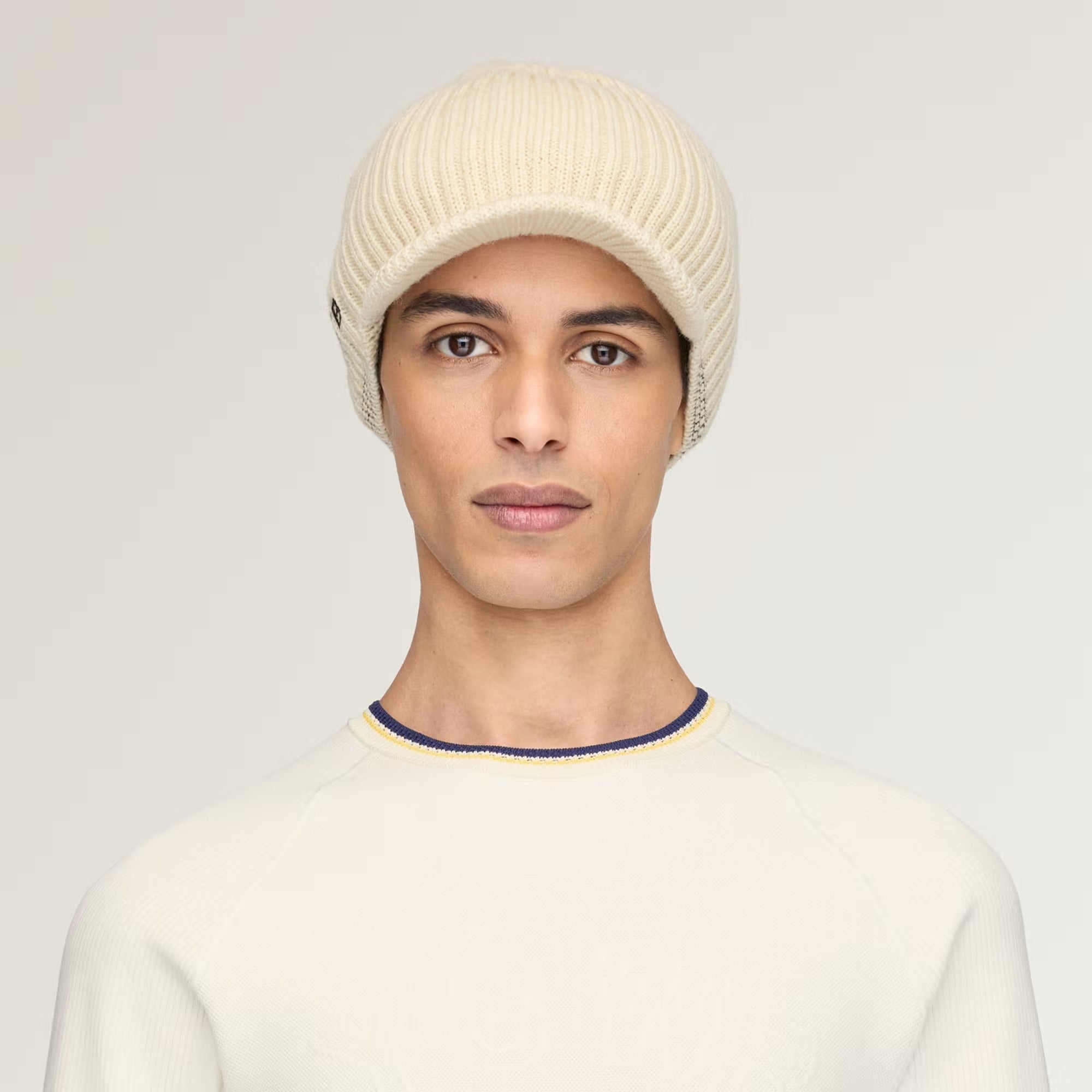 Tan hat worn by a person, showing the hat fit