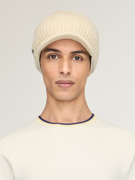 Tan hat worn by a person, showing the hat fit