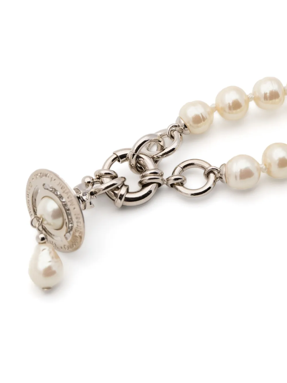 Close up of White necklace, showing texture of the pearl fabric