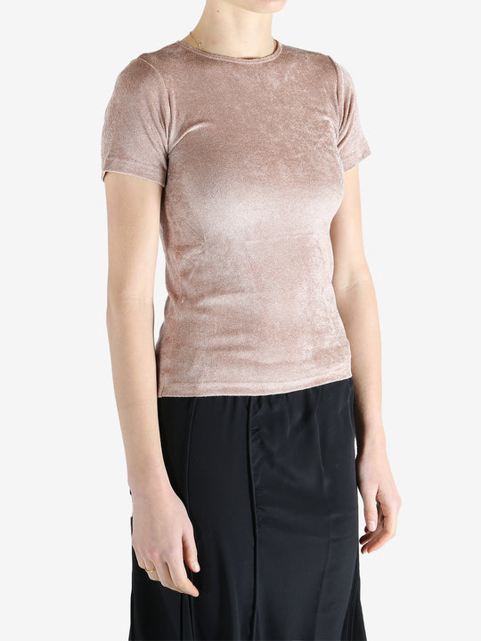 Pink t-shirt worn by a person, showing the shirt's fit