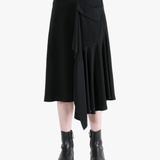 Black skirt worn by a person, showing the skirt fit