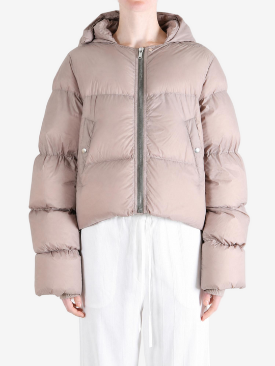 Tan jacket worn by a person, showing the jacket fit