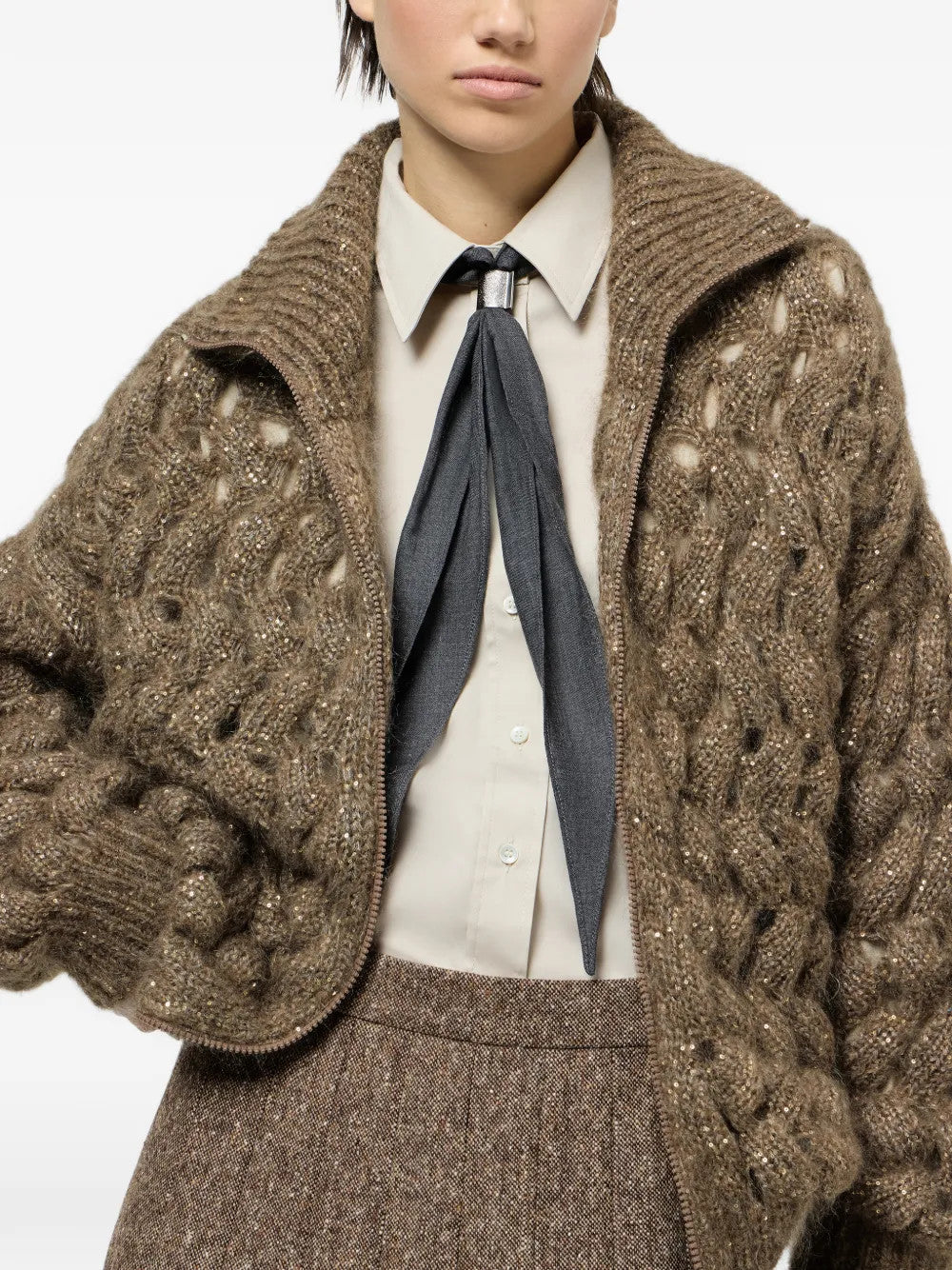 Brown knitwear worn by a person, showing the knitwear fit