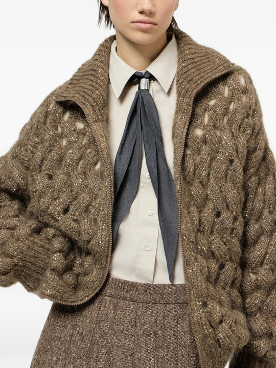 Brown knitwear worn by a person, showing the knitwear fit