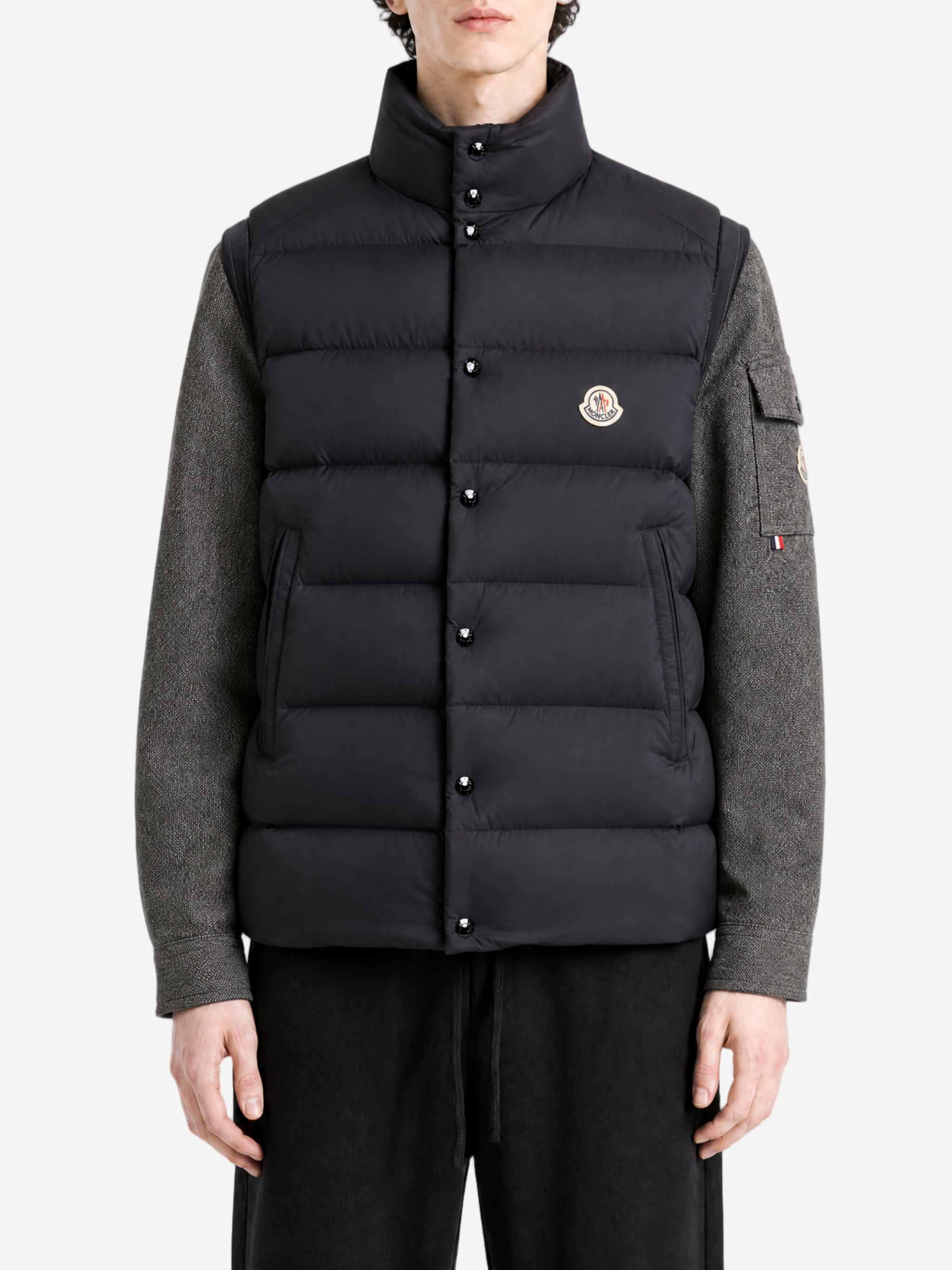 Black jacket worn by a person, showing the jacket fit