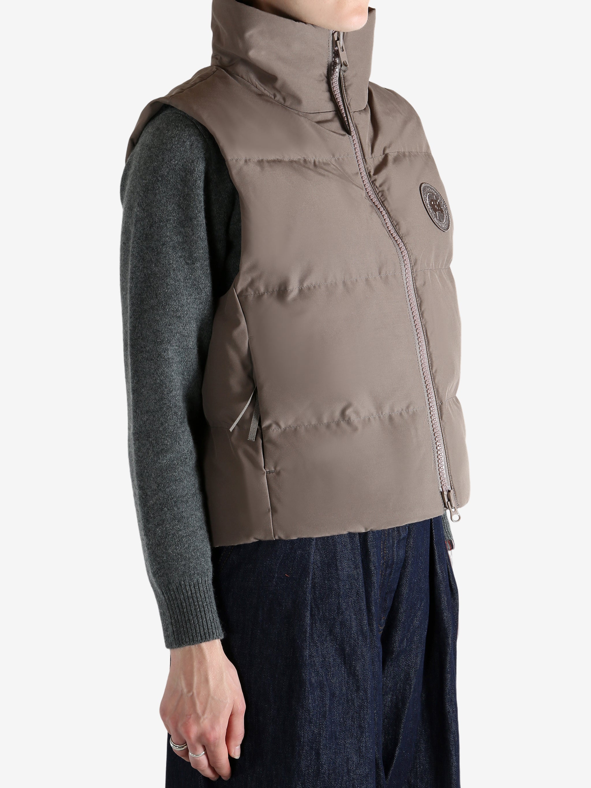 Brown vest worn by a person, showing the vest's fit