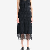 Black dress worn by a person, showing the dress's fit