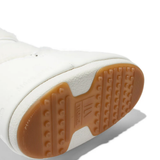 Close up of the white boot, showing texture of the rubber fabric