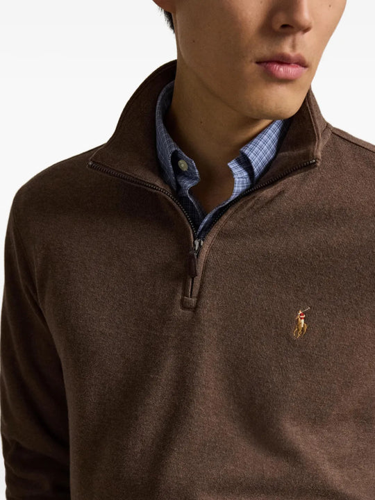 Brown knitwear worn by a person, showing the knitwear fit