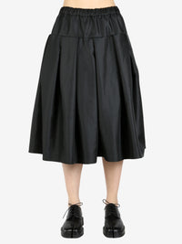 Black skirt worn by a person, showing the skirt's fit