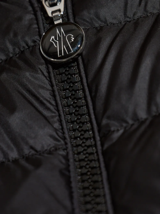 Close up of black jackets, showing texture of the nylon fabric