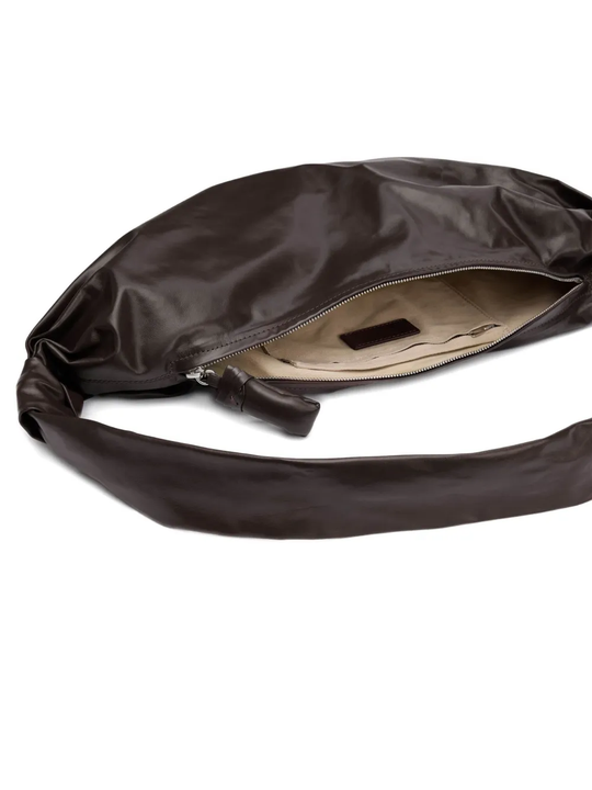 Close up of brown bag, showing texture of the Calf Leather fabric