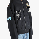 Black jacket worn by a person, showing the jacket's fit