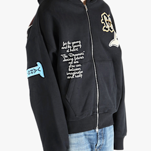 Black jacket worn by a person, showing the jacket's fit