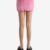 Pink skirt worn by a person, showing the skirt's fit