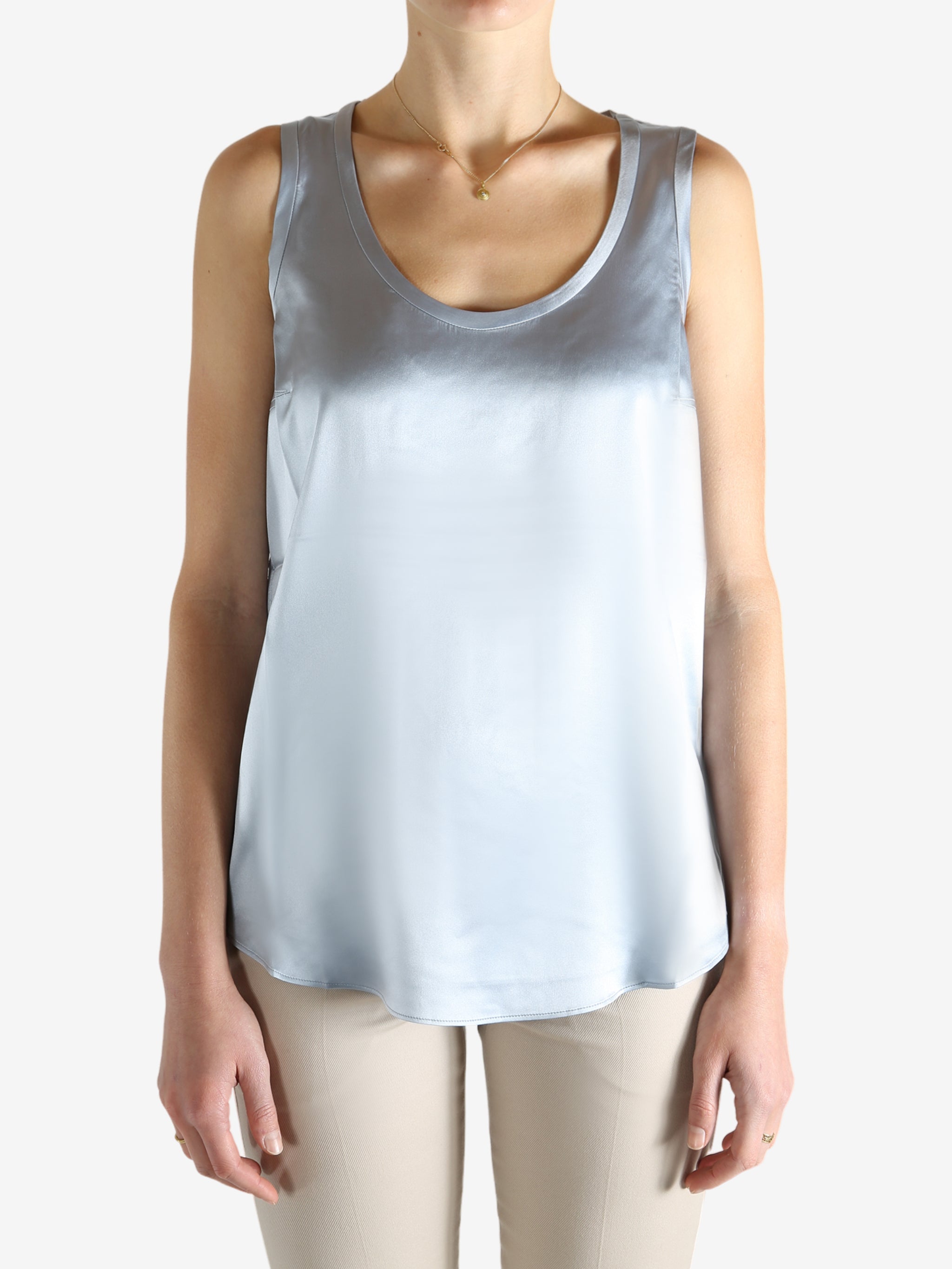 Grey t-shirts worn by a person, showing the t-shirts fit